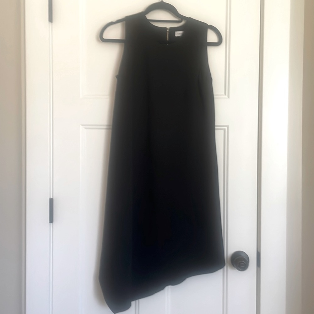 Black shift dress with an asymmetrical hemline. Calvin Klein NWT
